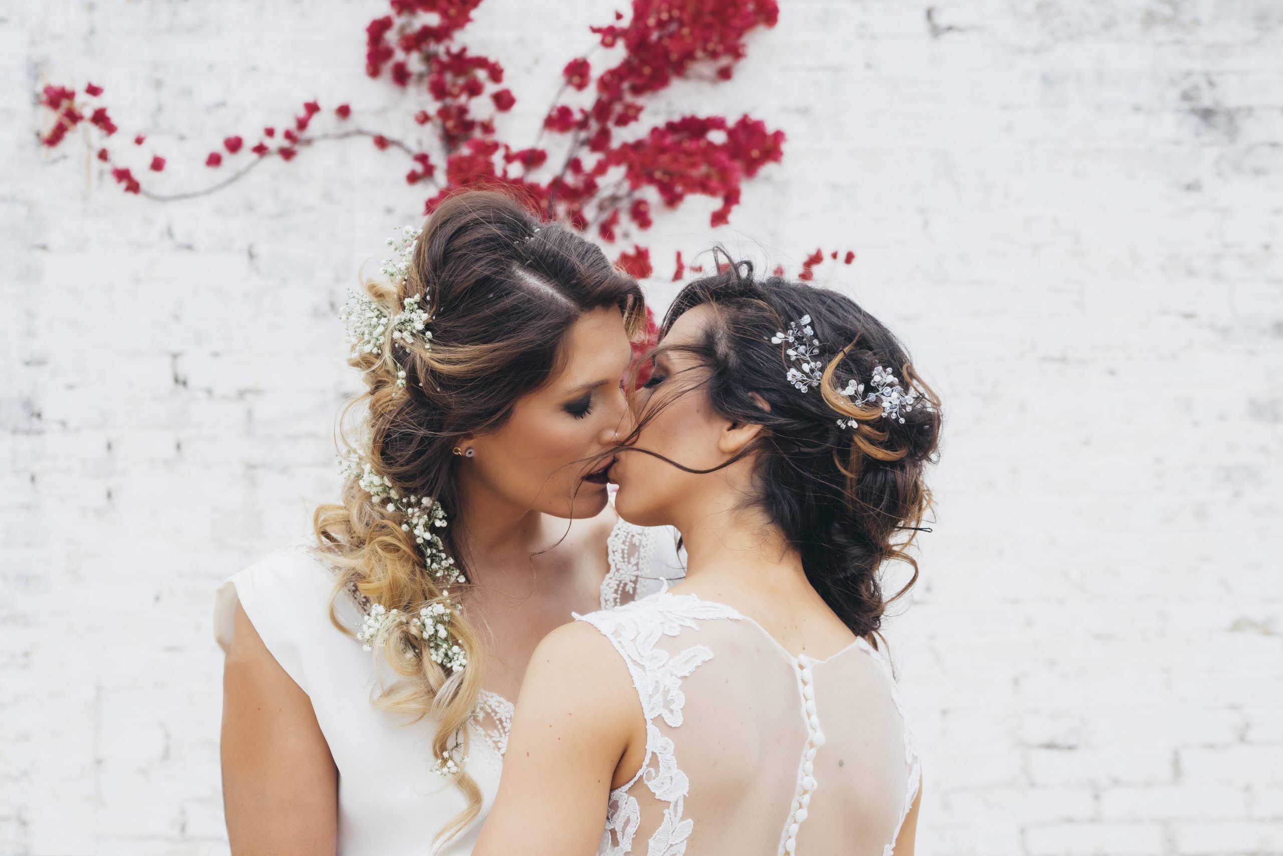 Portrait of a proud couple kissing each other with white wedding